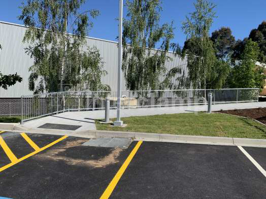 Primary school walkway featuring a safety balustrade made with Interclamp pedestrian barriers and tube clamp fittings, enhancing the safety of the school grounds.